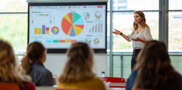 Classroom Management - Teacher clearing doubts of a student in a classroom